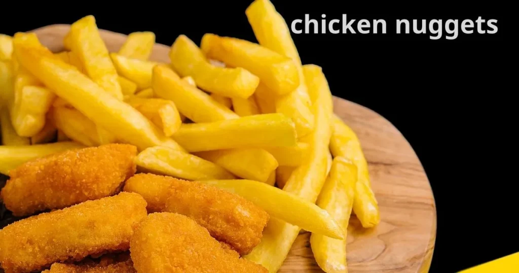 Children enjoying chicken nuggets on a colorful plate with dipping sauces."